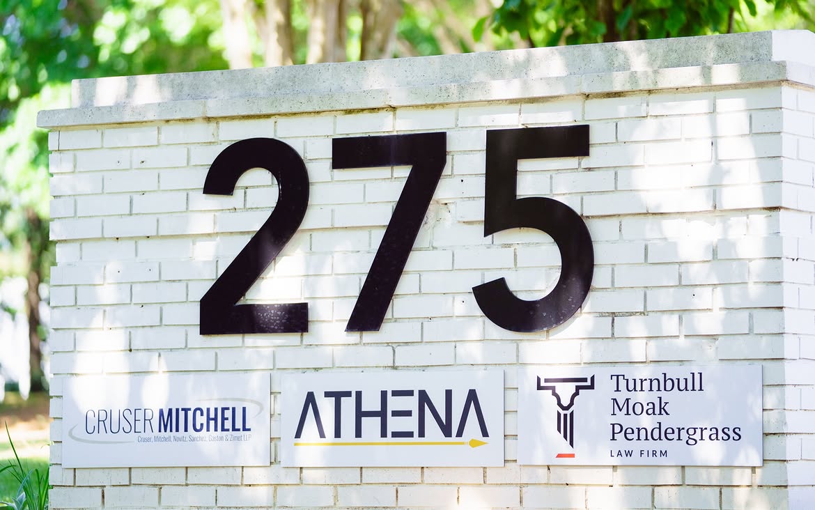 Exterior monument sign at 275 showing the Athena Engineering logo panel